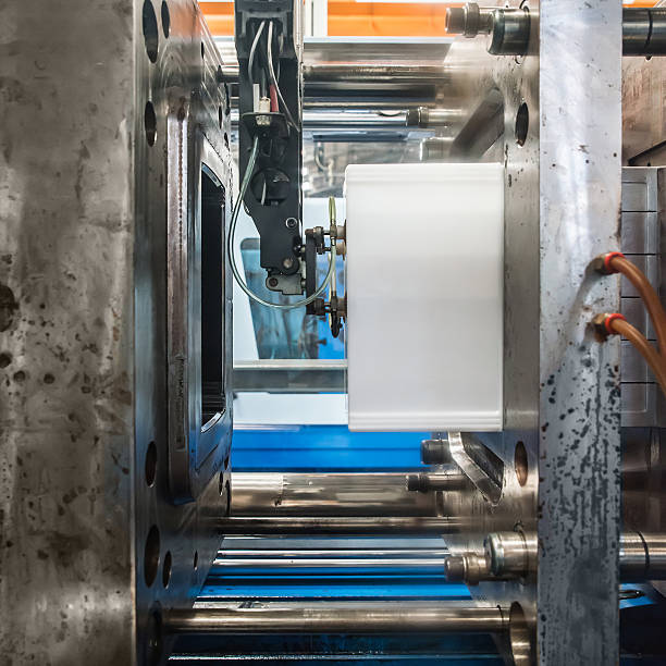 Plastic Injection molding machine working in factory Composites compression molding and